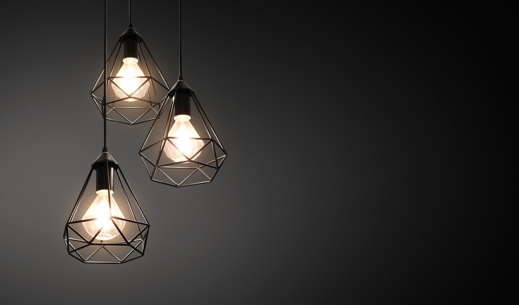 Decorative ceiling lights / hanging lights on dark background with copy space
